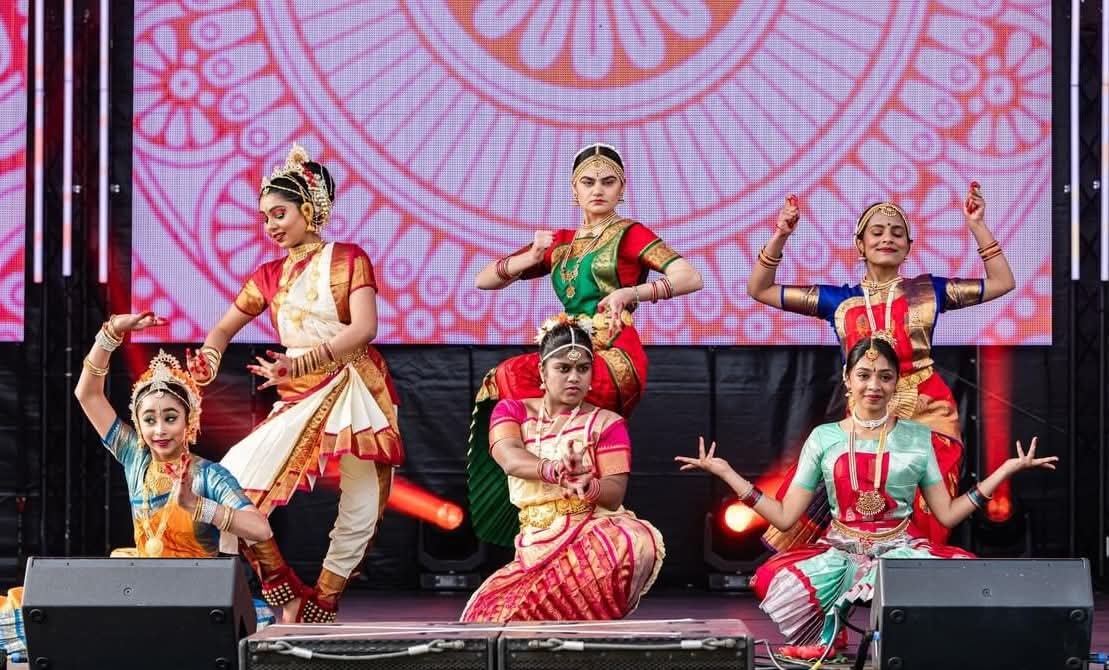 Indian dancers in traditional costumes at Diwali festival