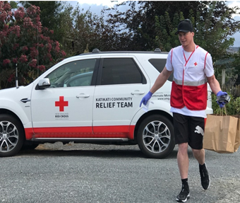 Picture of a Red Cross volunteer doing food deliveries in Katikati