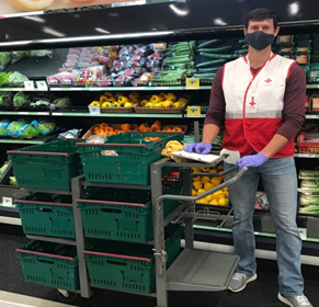 Picture of a Red Cross volunteer shopping at the supermarket