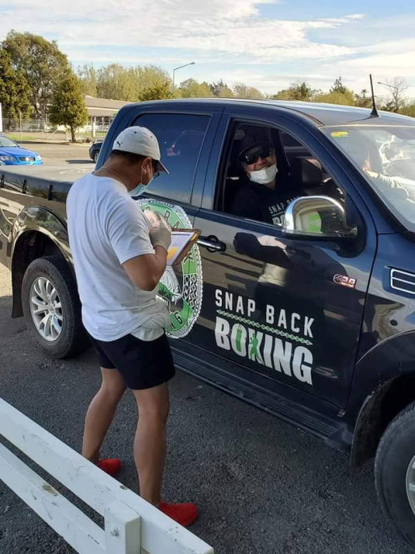 Picture of Snap Back Boxing vehicle being used to deliver care packages