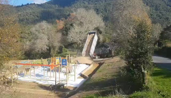 Picture of the community building the playground